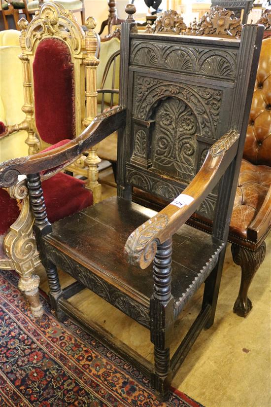 A Victorian 17th century style carved oak wood seat elbow chair (a.f.)